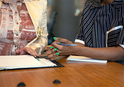 two people consulting at a table